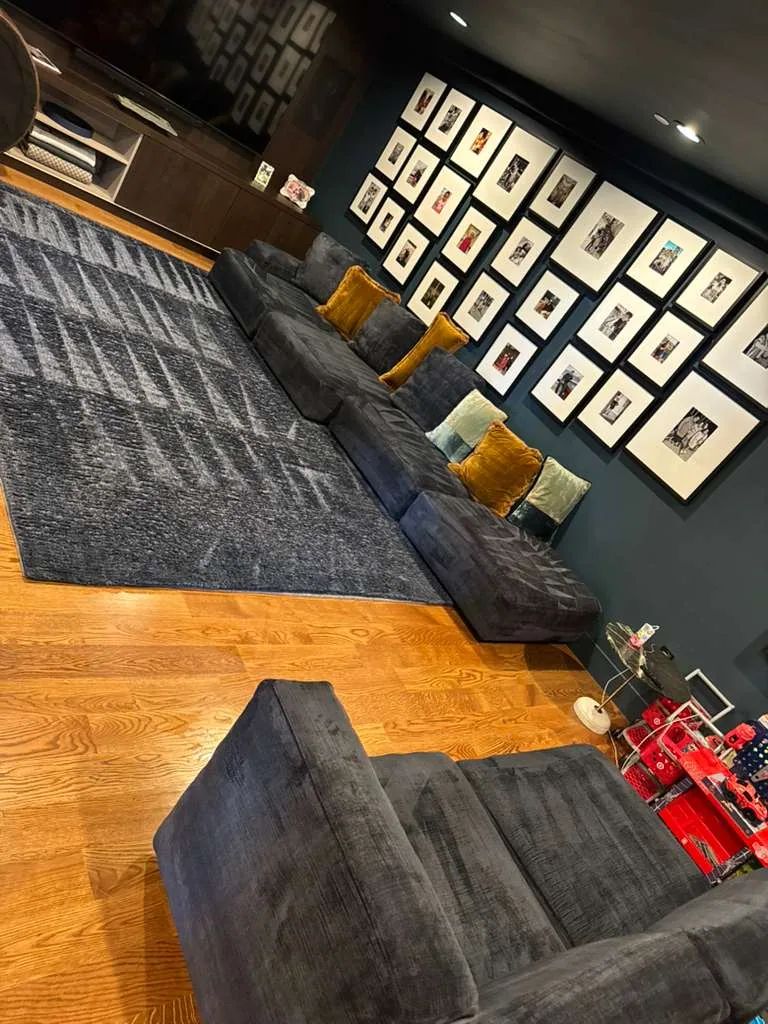 Navy fabric sectional and armchair cleaned in a den