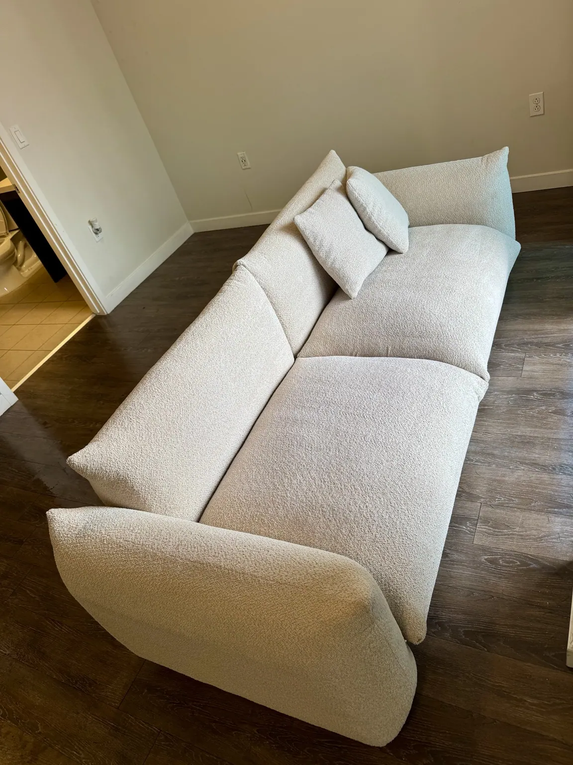 Cream curved sofa after upholstery cleaning