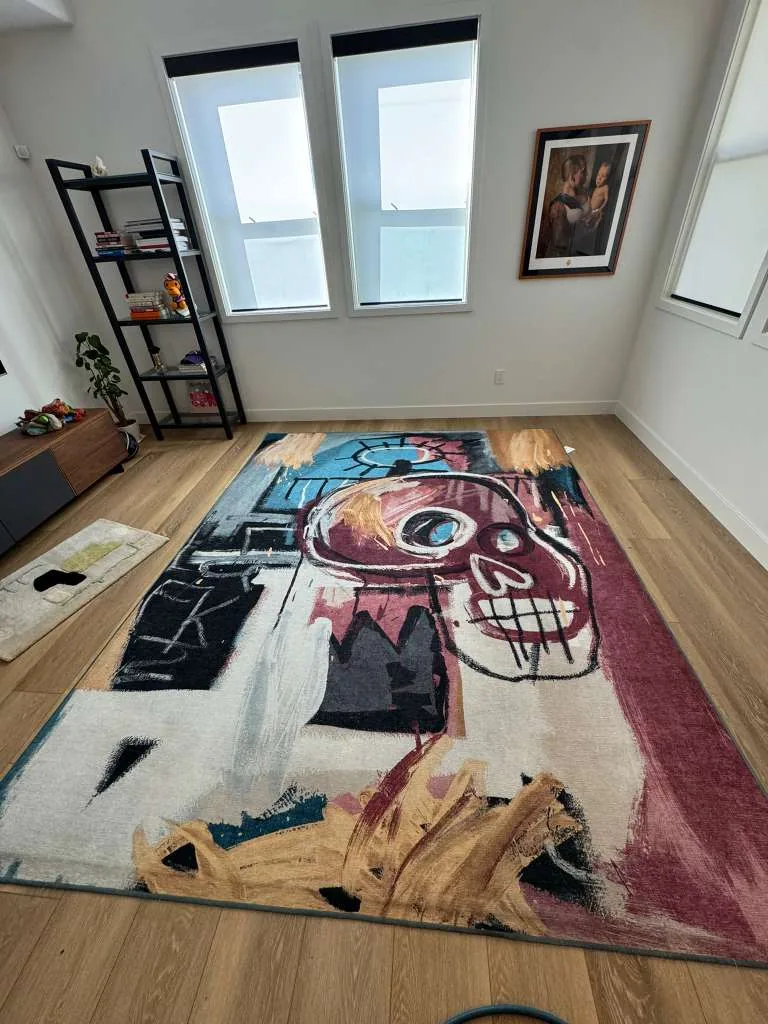 Modern art-print area rug cleaned in a bedroom