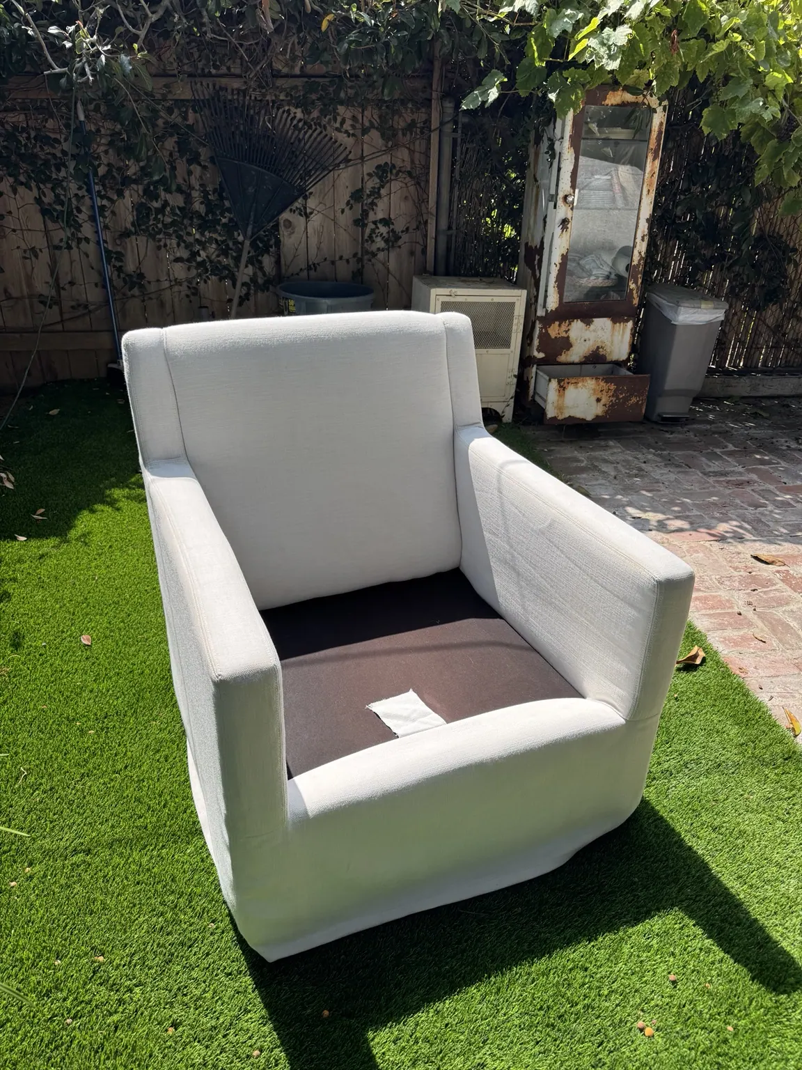 White wing chair cleaned outdoors