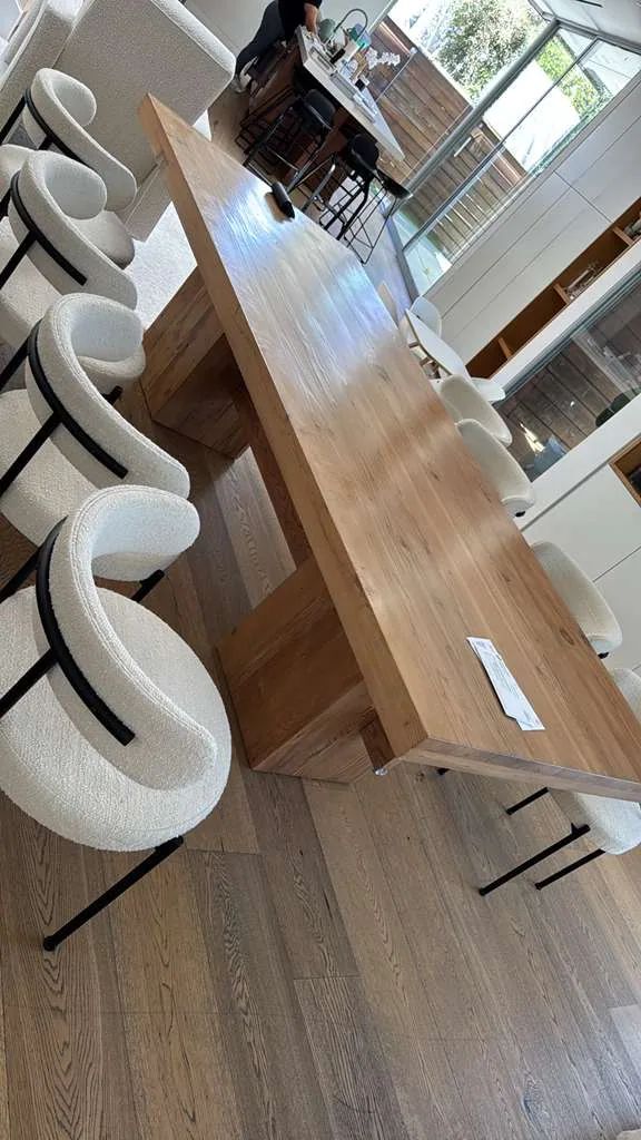 Boucle dining chairs cleaned around an oak dining table