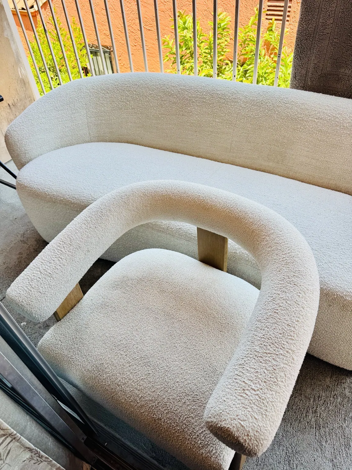 Cream boucle accent chairs after upholstery cleaning