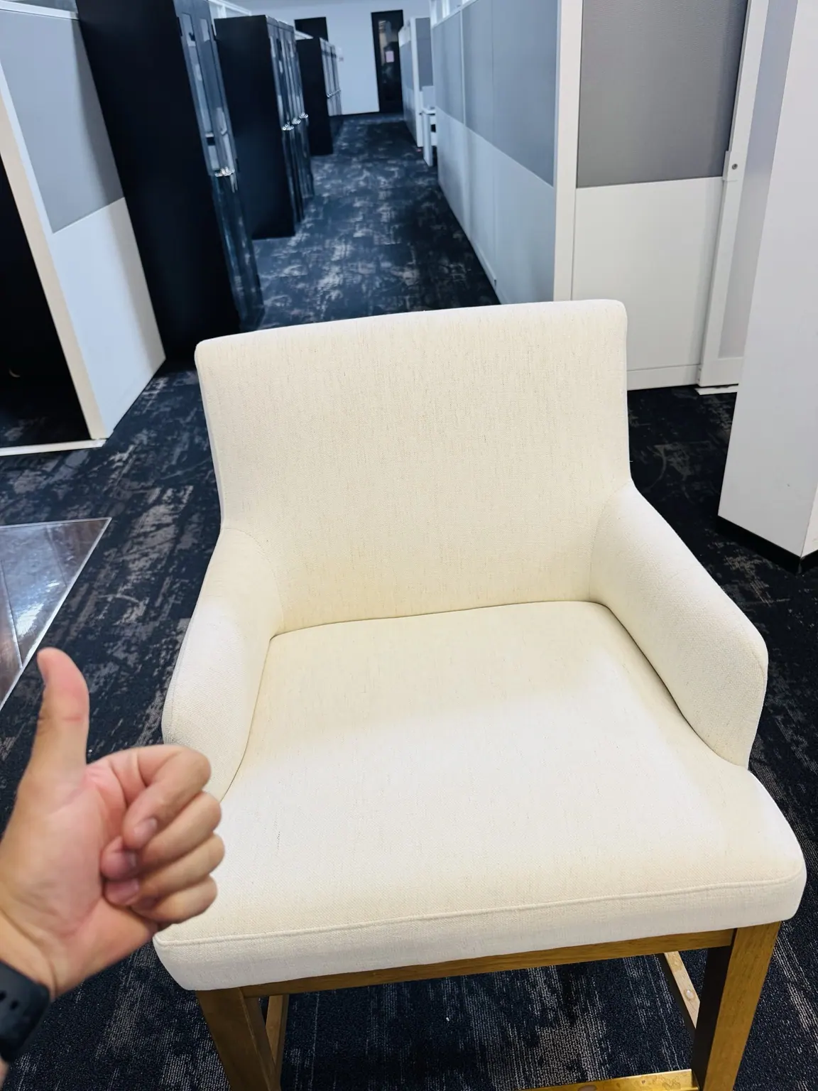 White accent chair cleaned in an office lobby