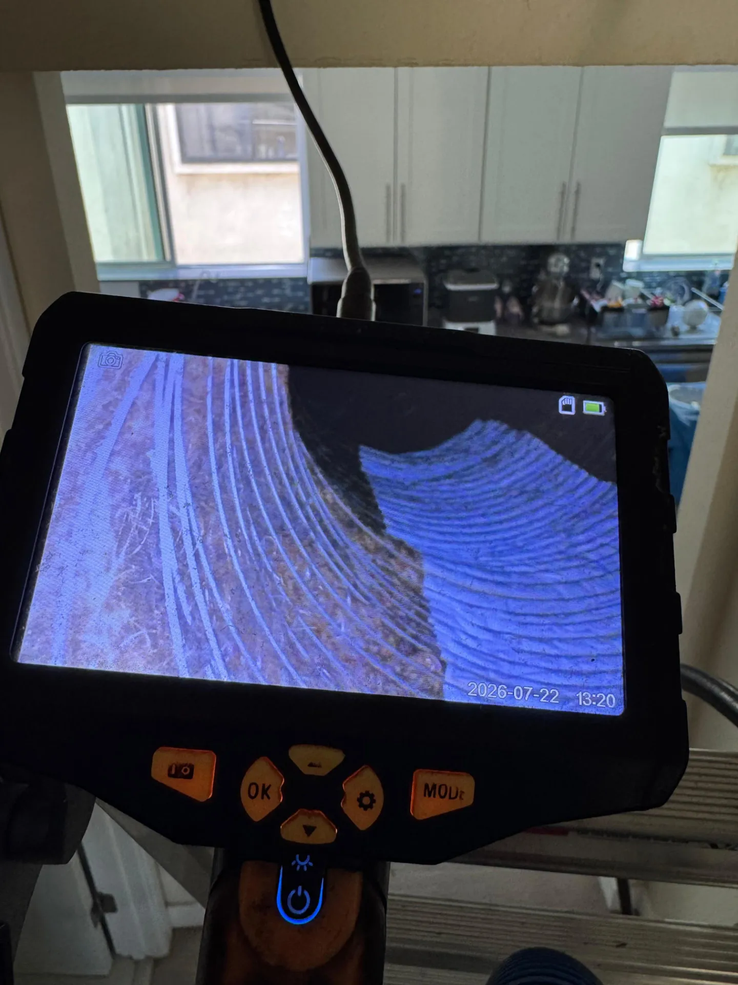 Inspection camera monitor displaying the inside of flexible ductwork