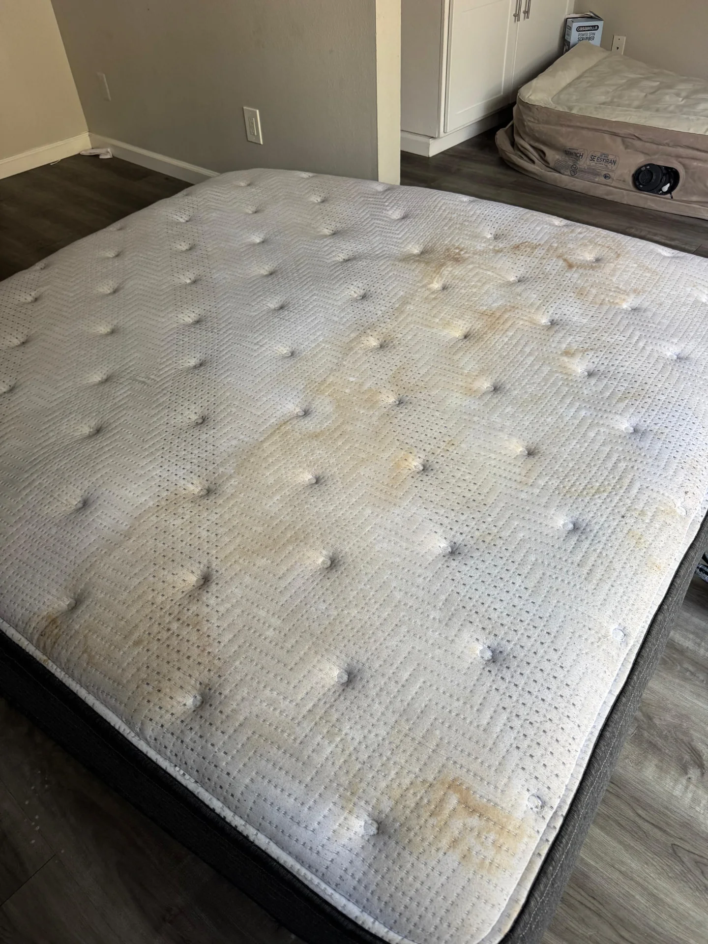 Uncovered quilted mattress with visible surface marks