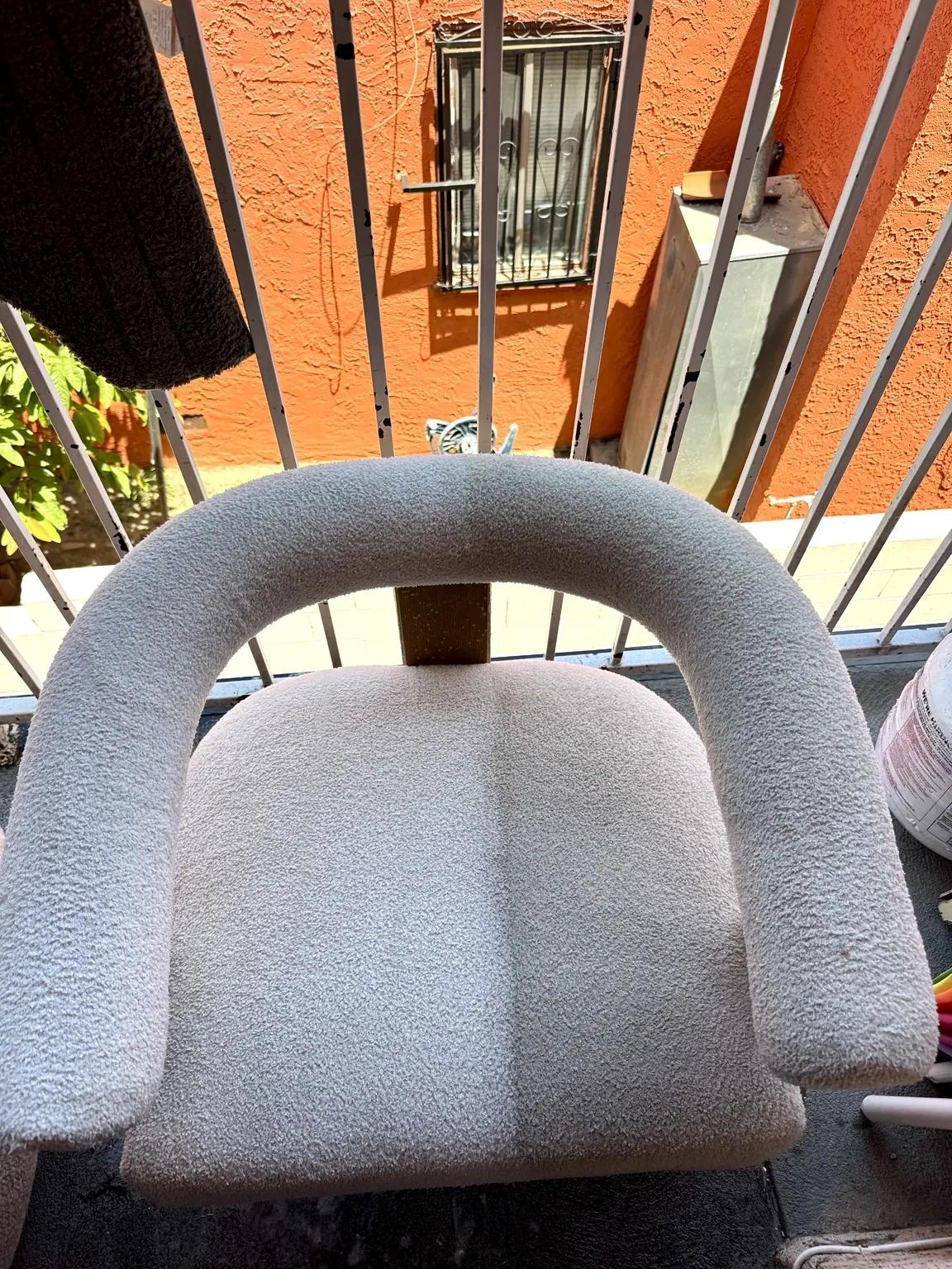 Close-up of a cleaned cream boucle armchair