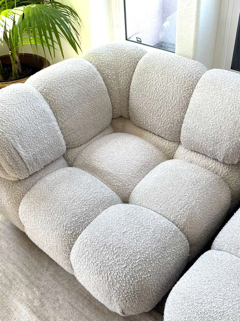 Close-up of a cream boucle cloud-style sectional after upholstery cleaning